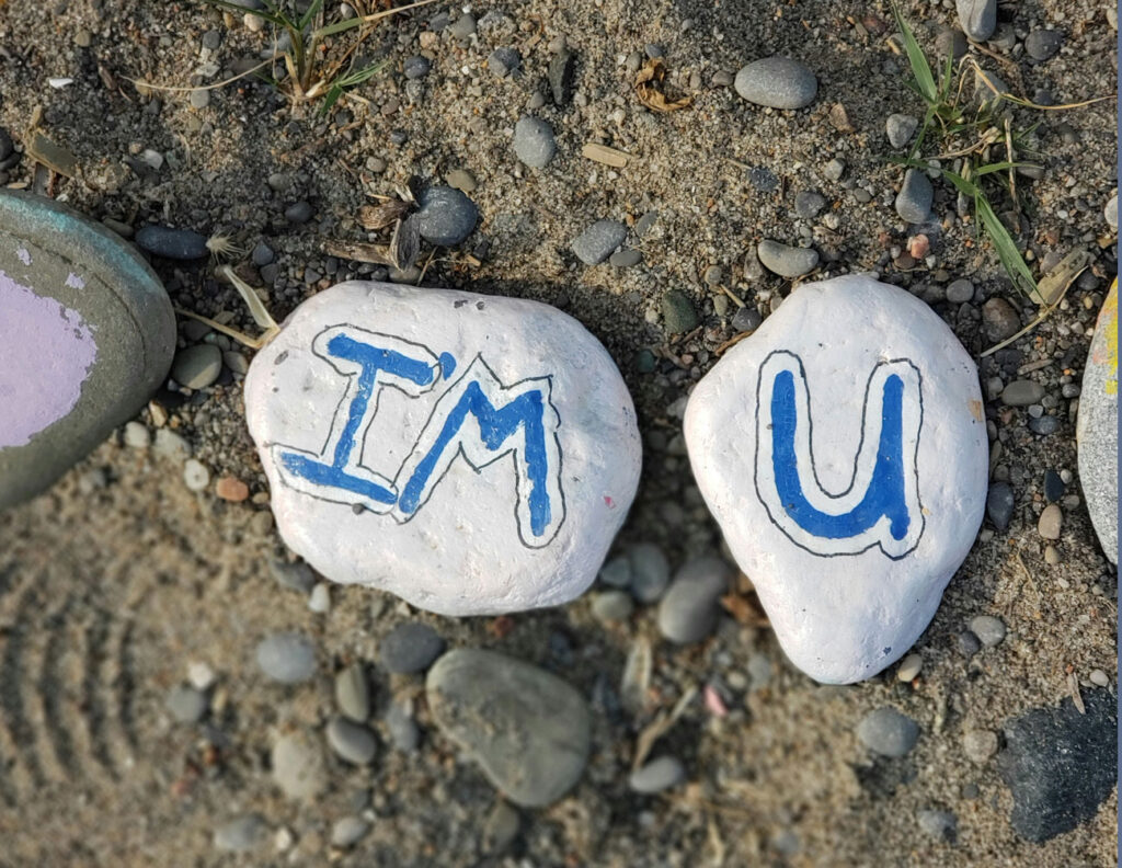 Stones on which "i'm u" is drawn