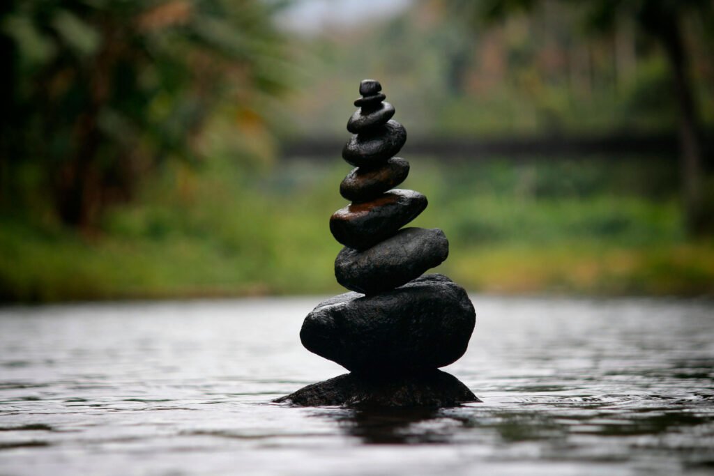 stones balanced in a river. Third eye chakra