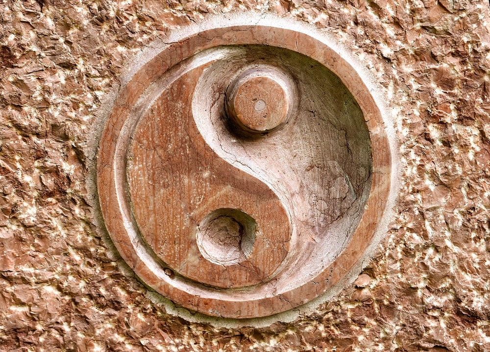 ying yan carved in stone. Third eye chakra