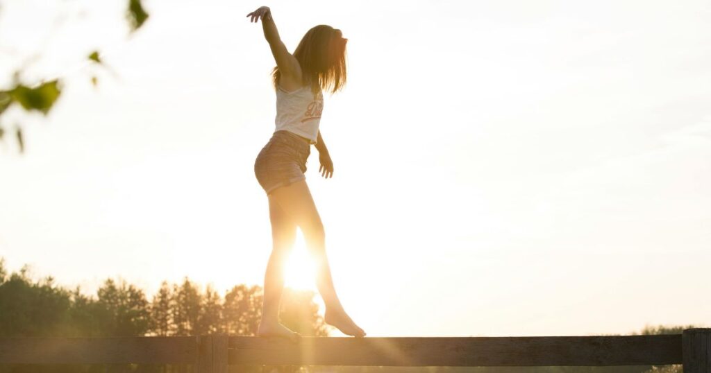 woman balancing on board