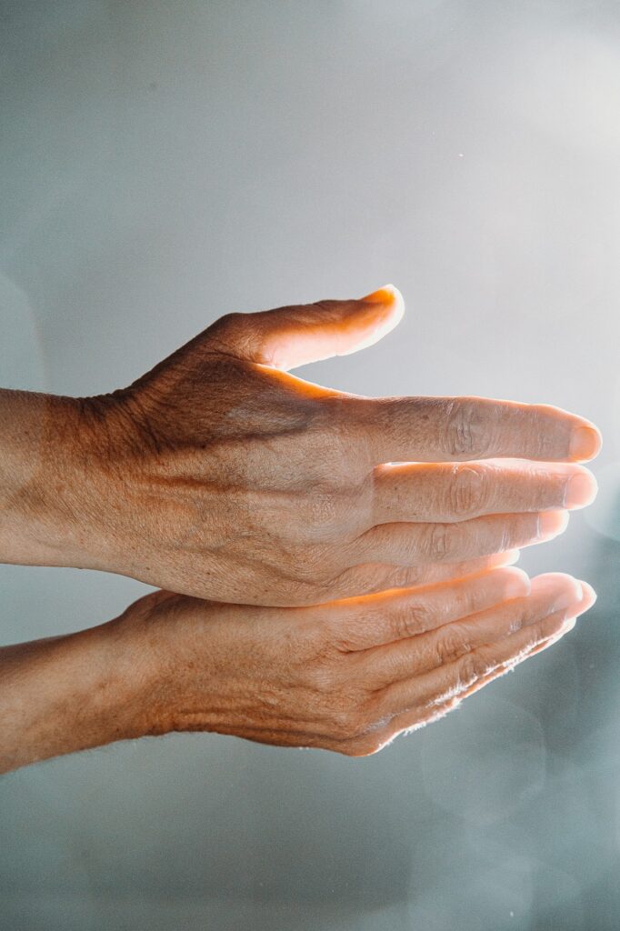 hands illuminated by sunlight