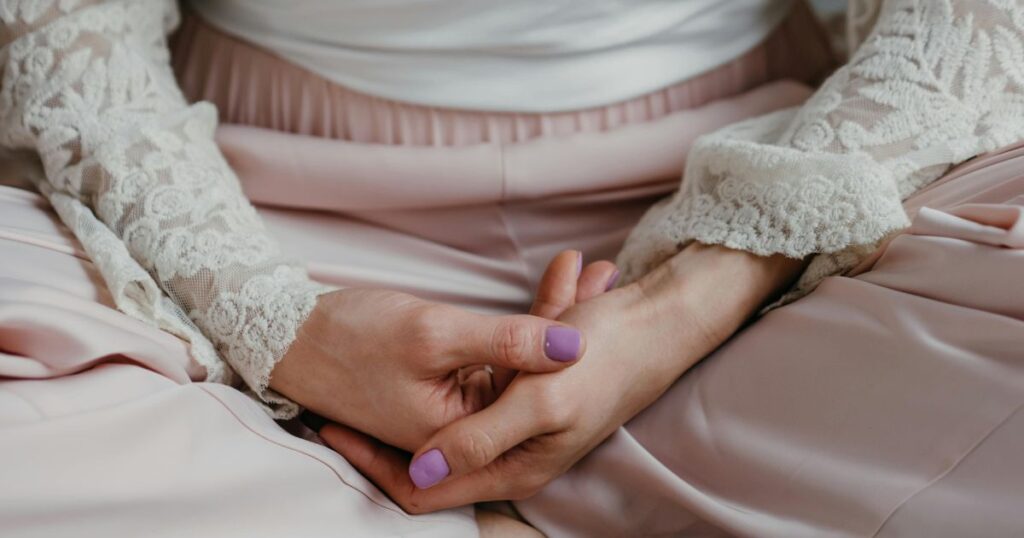 hands in meditation posture